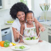 A mother and daughter preparing a healthy meal