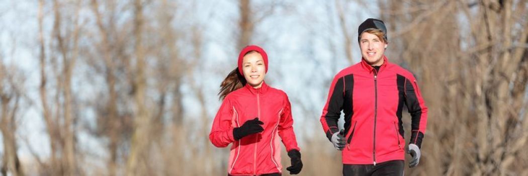 A man and a woman getting exercise in winter weather