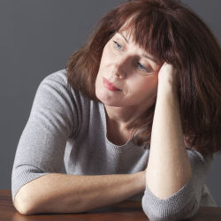 frustrated middle age woman reflecting on her decisions