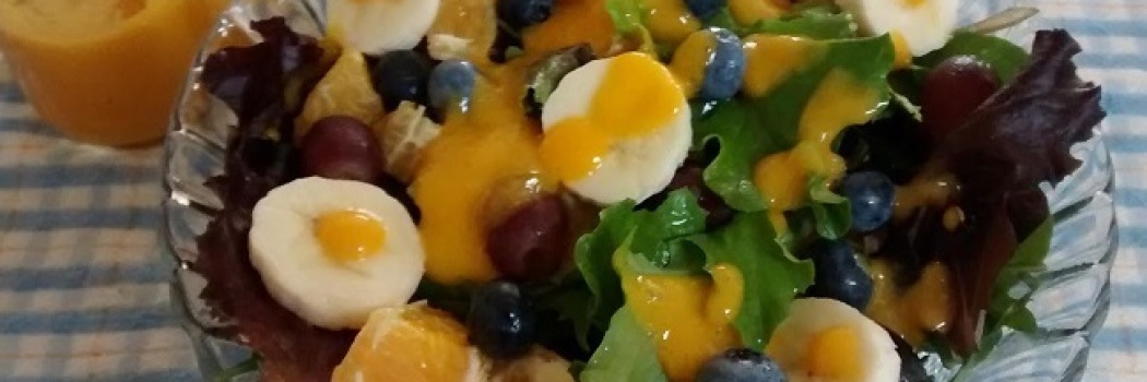 A homemade salad with mango dressing