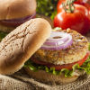 healthy vegetarian black bean burger with lettuce, tomato, and onion