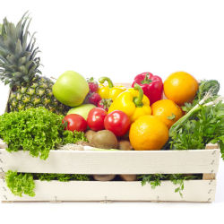 A box filled with delicious greens, fruits, and vegetables